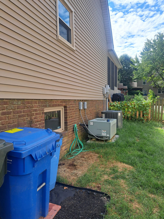 The outside view of the kitchen window and the unused space.